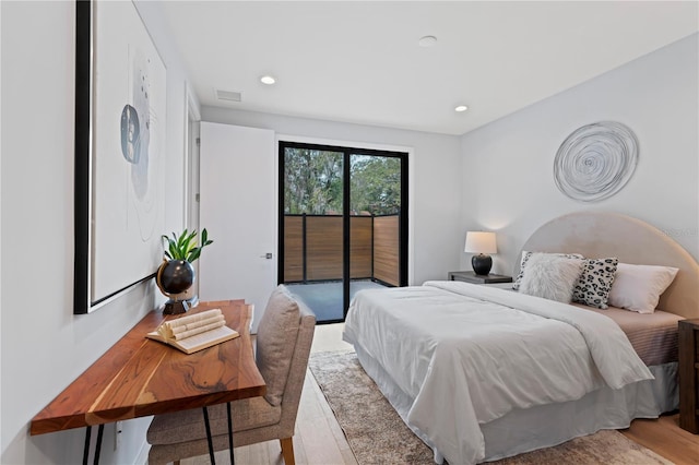 bedroom with access to exterior, recessed lighting, and visible vents