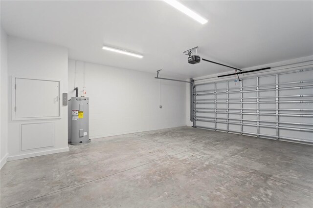 532 W Plaza Pl Unit 2, Tampa, FL 33602 - garage with a garage door opener and electric water heater