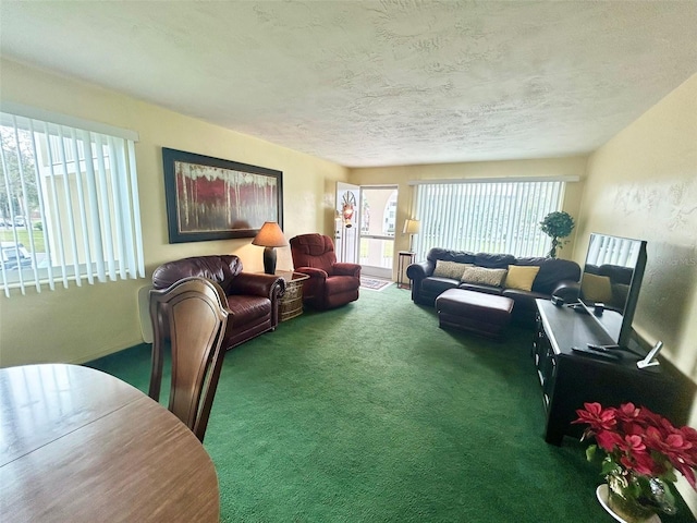 living room with a textured ceiling and dark carpet