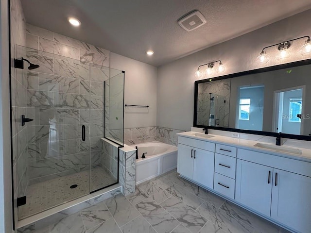 bathroom with vanity, plus walk in shower, and a textured ceiling