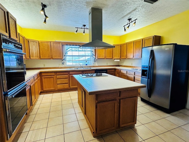 kitchen with light tile patterned flooring, sink, a center island, stainless steel fridge with ice dispenser, and island exhaust hood
