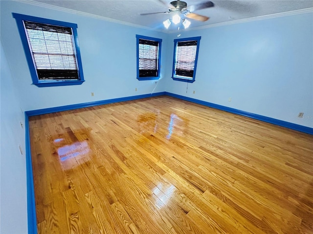 spare room with ceiling fan, ornamental molding, light hardwood / wood-style flooring, and a textured ceiling