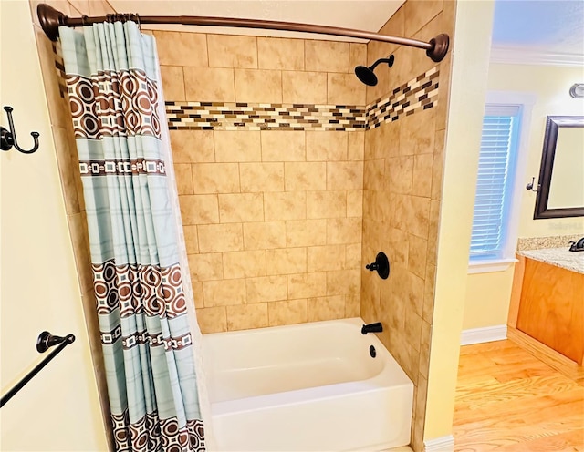 bathroom with vanity, hardwood / wood-style flooring, ornamental molding, and shower / tub combo with curtain