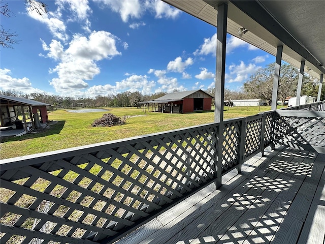 wooden terrace with a yard