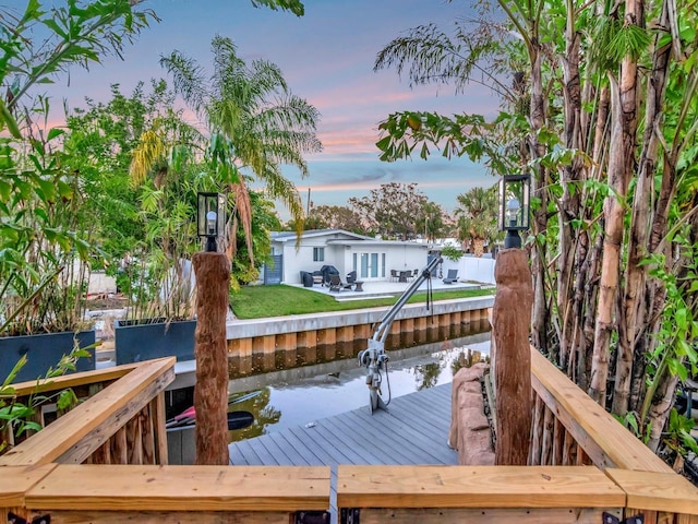 wooden terrace with a dock