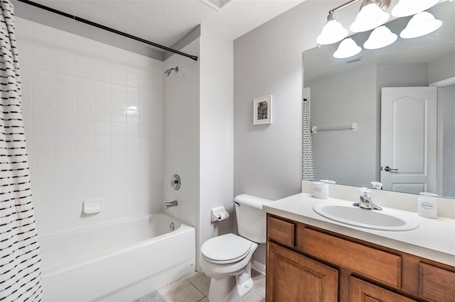 bathroom featuring toilet, visible vents, vanity, tile patterned floors, and shower / bath combo with shower curtain