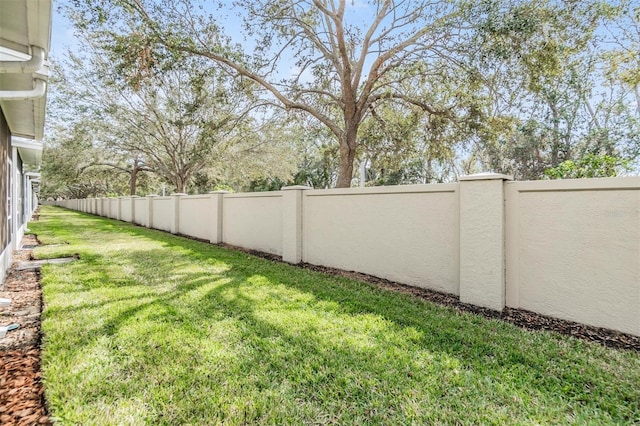 view of yard with a fenced backyard