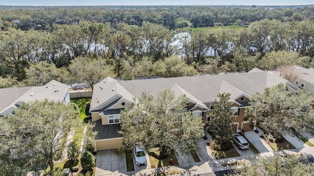 bird's eye view with a residential view and a wooded view