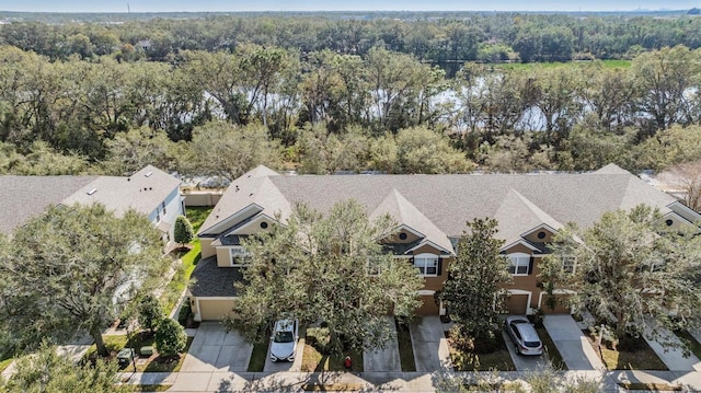 aerial view with a residential view and a view of trees