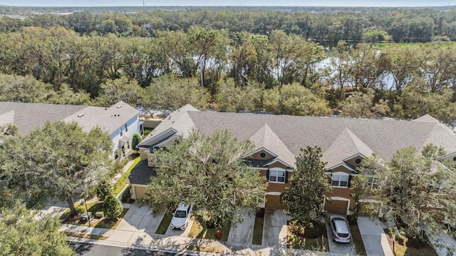 drone / aerial view featuring a view of trees