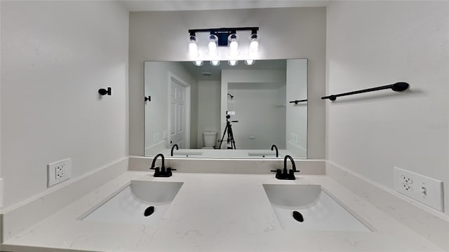 bathroom with vanity and toilet