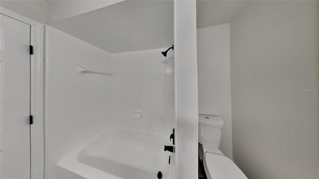 bathroom with shower / bathing tub combination and toilet