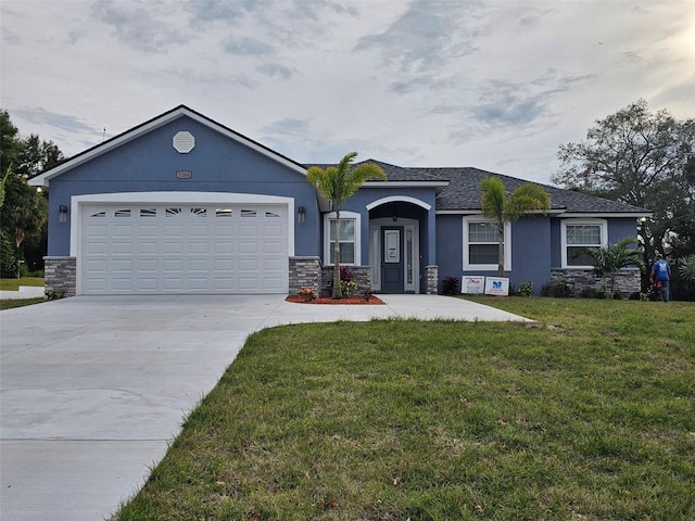 view of front of house with a front lawn and a garage