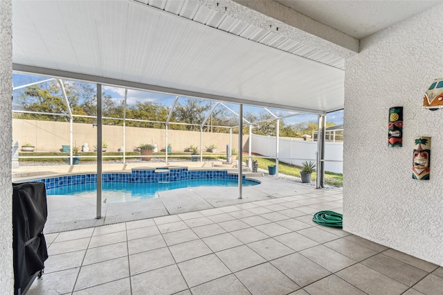 view of pool with a fenced in pool, a fenced backyard, a jacuzzi, a lanai, and a patio area