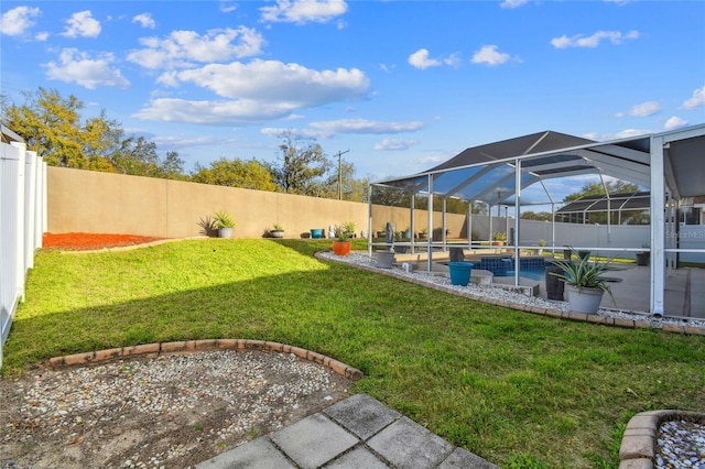 view of yard featuring a fenced in pool, glass enclosure, and a fenced backyard