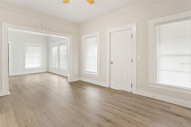 spare room with ceiling fan and light hardwood / wood-style floors