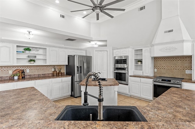 kitchen with sink, stainless steel appliances, and white cabinets