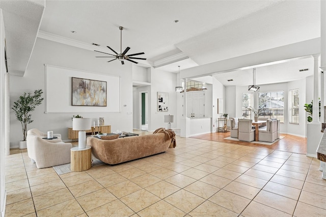 tiled living room featuring ornamental molding and ceiling fan