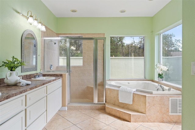 bathroom featuring vanity, tile patterned floors, and independent shower and bath