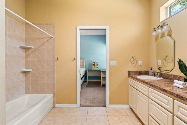 bathroom featuring vanity, tile patterned floors, and tiled shower / bath