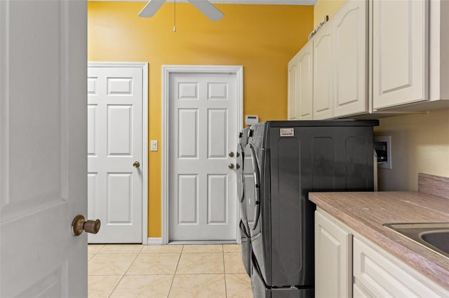 laundry room featuring sink, cabinets, washer and dryer, light tile patterned floors, and ceiling fan