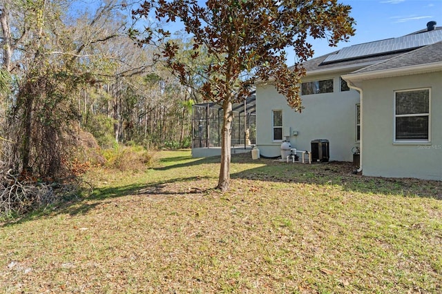 view of yard featuring a lanai