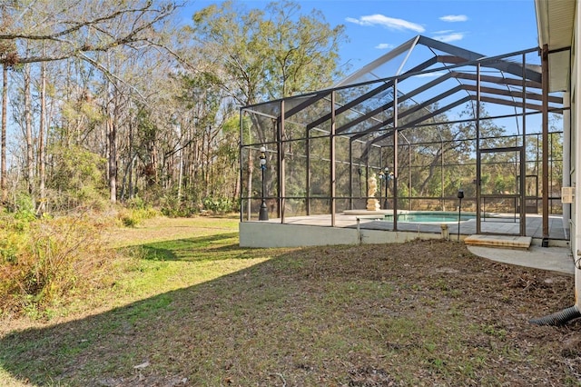 view of yard featuring a lanai and a patio area