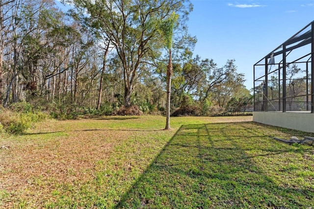 view of yard with a lanai