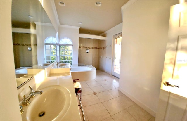 full bath with tile patterned flooring, a healthy amount of sunlight, a garden tub, and crown molding