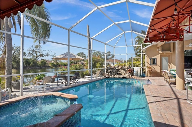 view of swimming pool with a water view, a pool with connected hot tub, a lanai, and a patio