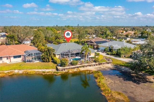 drone / aerial view featuring a water view and a residential view