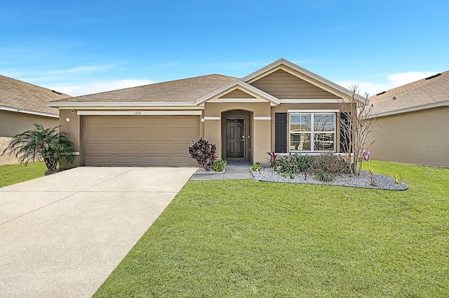 ranch-style house with a garage and a front lawn