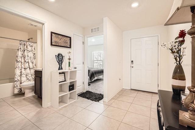 entryway featuring light tile patterned floors