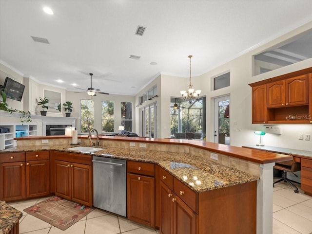 kitchen with light tile patterned flooring, sink, hanging light fixtures, ornamental molding, and dishwasher