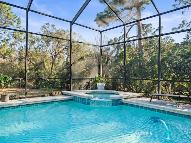 view of swimming pool featuring glass enclosure and an in ground hot tub