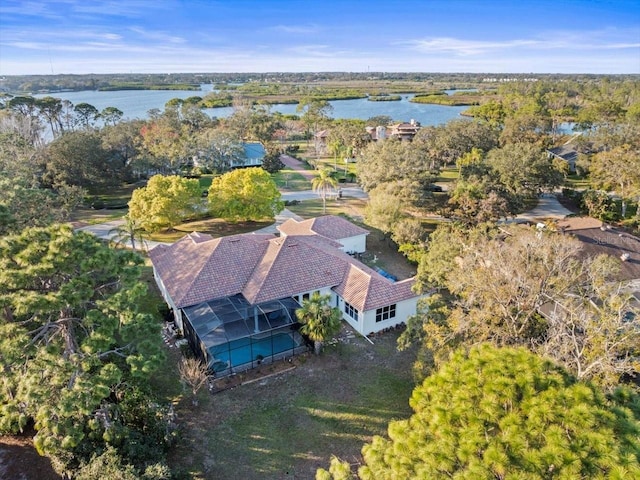 birds eye view of property with a water view