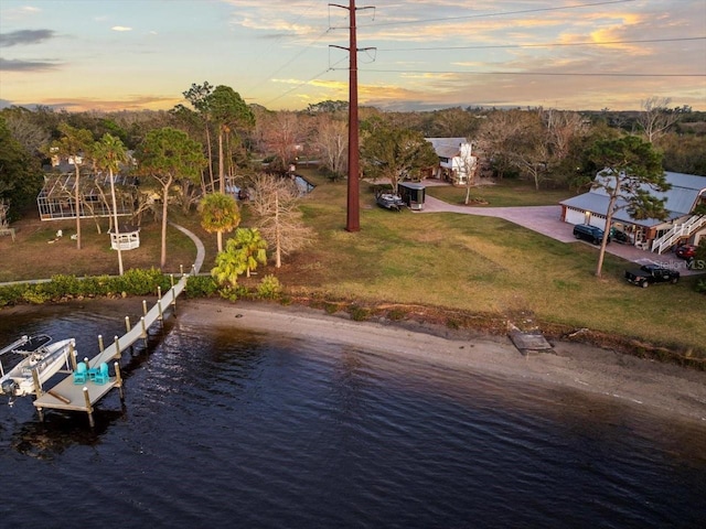 aerial view at dusk with a water view