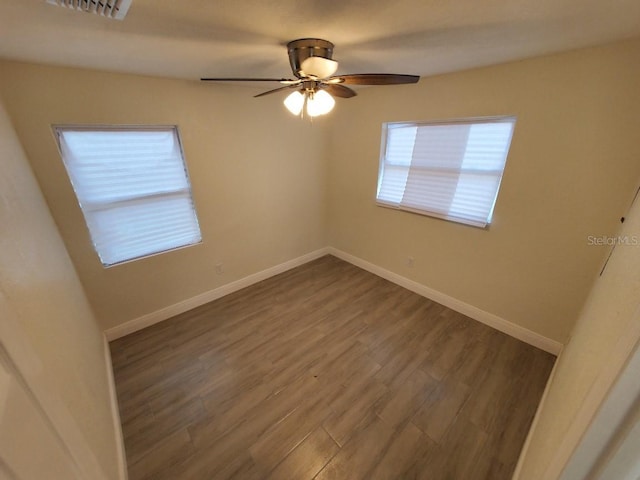 unfurnished room with hardwood / wood-style floors and ceiling fan