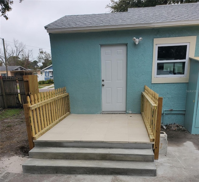 entrance to property with a patio area