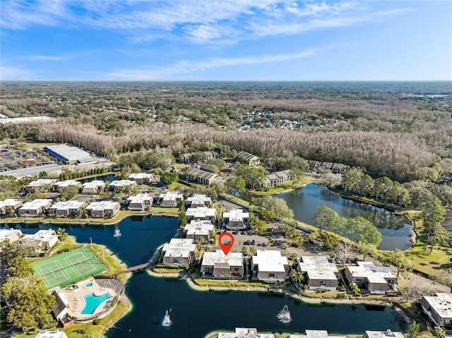 birds eye view of property featuring a water view