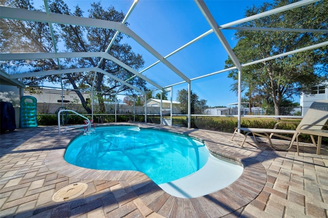 view of pool featuring a lanai and a patio