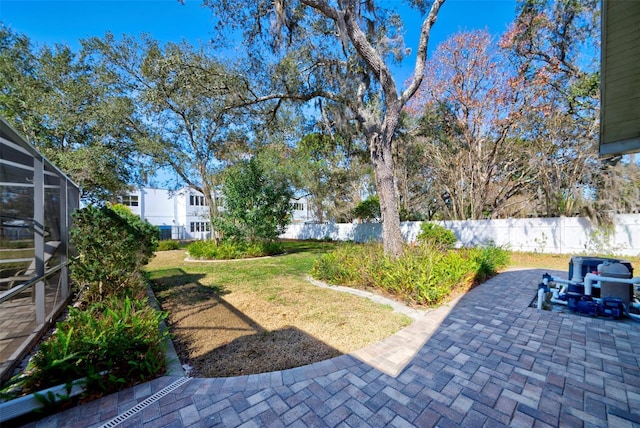 view of yard with a lanai and a patio area