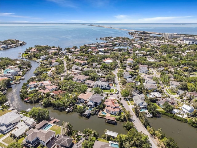 drone / aerial view featuring a residential view and a water view