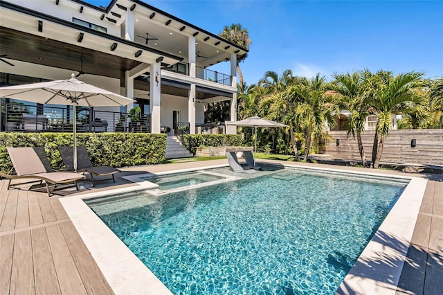pool featuring a patio, fence, and ceiling fan