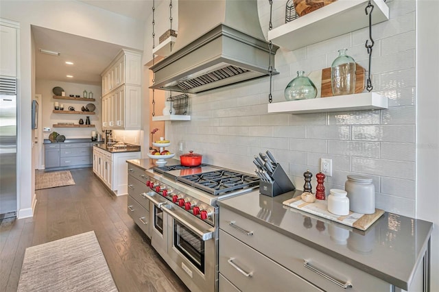kitchen featuring custom exhaust hood, decorative backsplash, open shelves, and high end appliances
