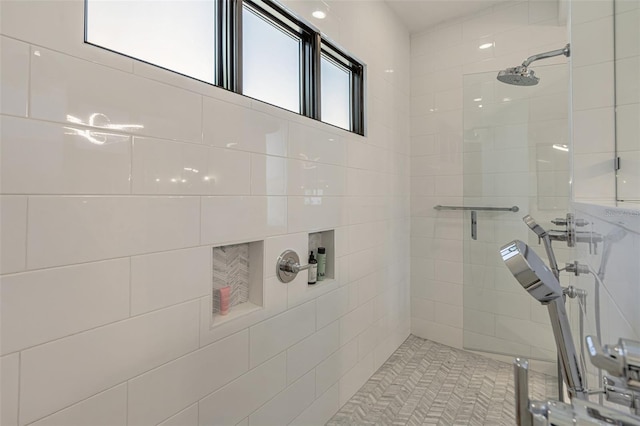 full bathroom with tiled shower