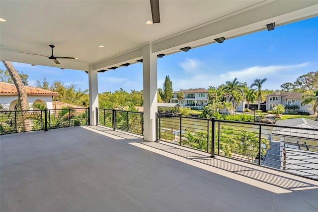 view of patio / terrace with a residential view, a balcony, and ceiling fan