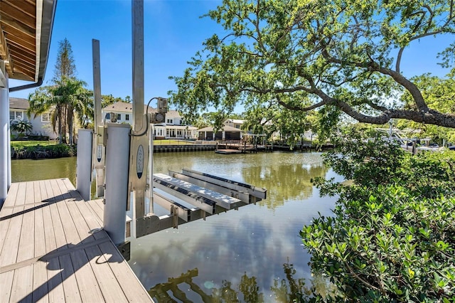 view of dock with a water view and boat lift