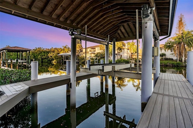 view of dock with a water view and boat lift