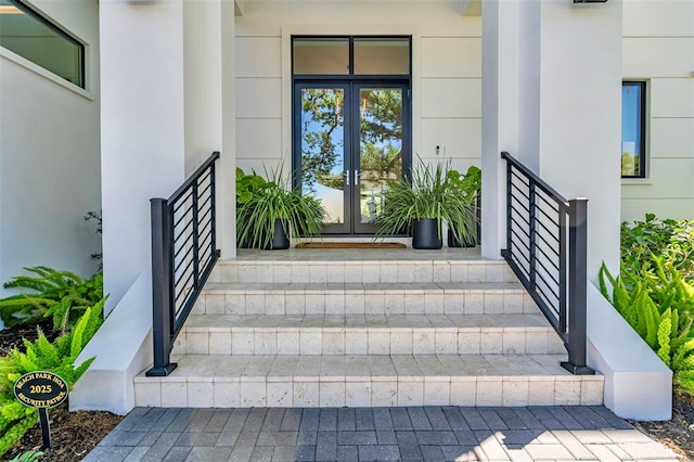doorway to property with french doors and stucco siding